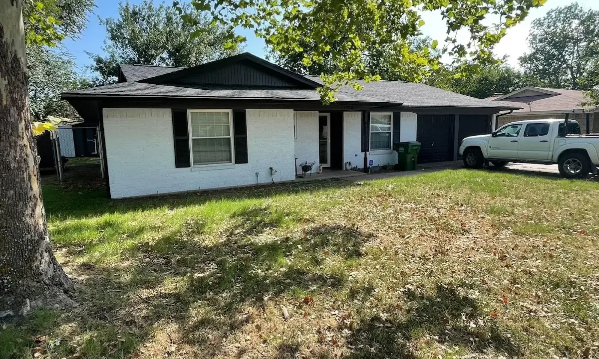 Professional roofing crew working on a residential roof in Victoria
